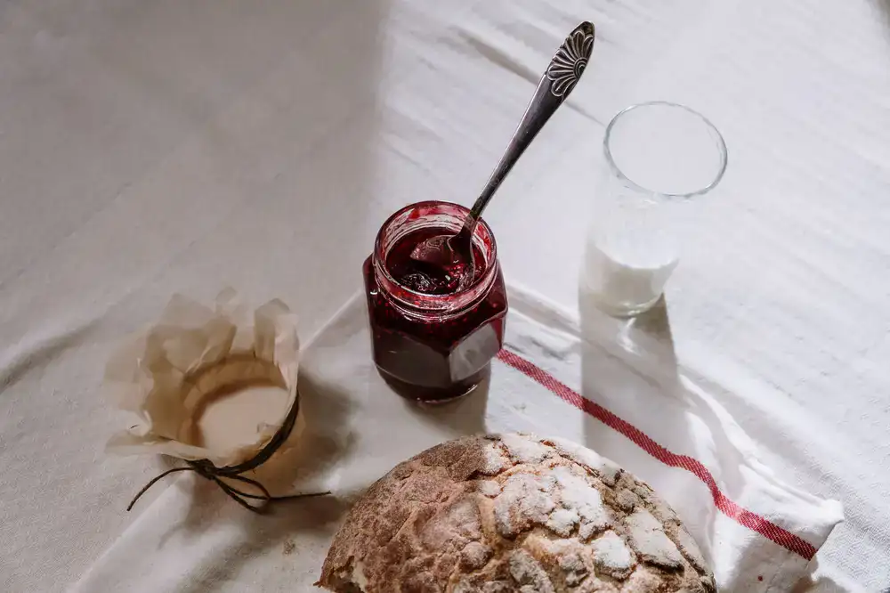 Bubbly active sourdough starter in a glass jar