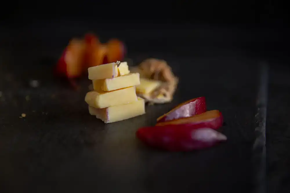 Selection of aged artisan cheeses on a slate board